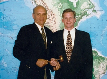 Tripp and Louis Davis in front of a map